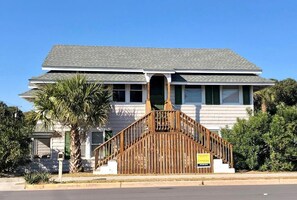A two-story house with a wooden staircase leading to a front door. - Salley/morrison (Edisto Island)