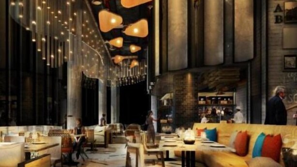 Een modern interieur met een lange eettafel, hangende吊灯 en een bar.