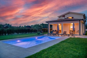 A house with a swimming pool, outdoor furniture, and a garden. - Holiday house Luca in Poreč (Porec)