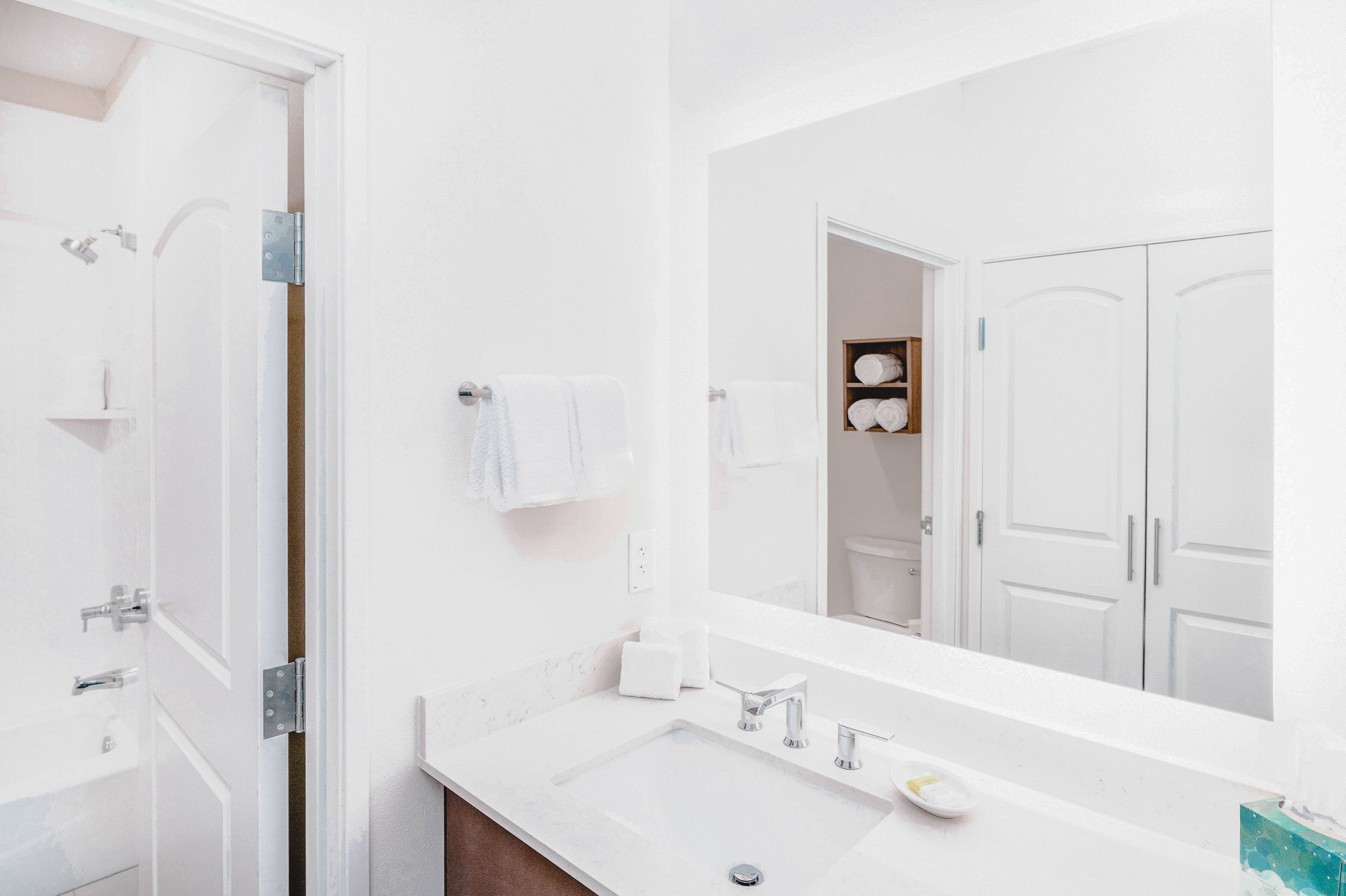 rainfall showerhead, hair dryer, towels, soap