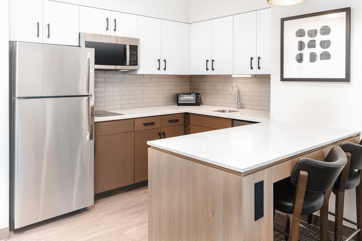 full-sized fridge, microwave, stovetop, dishwasher