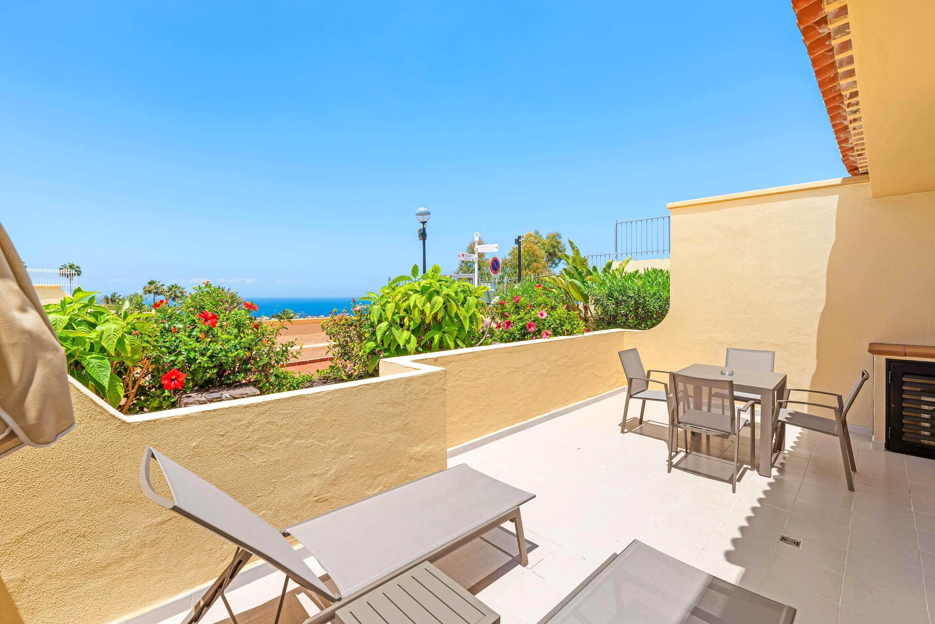 1-Bedroom Superior Apartment, Ocean View | In-room safe, desk, laptop workspace, iron/ironing board