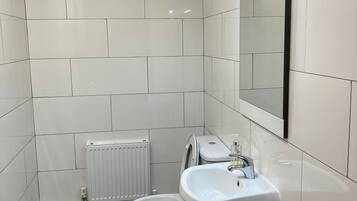 Bathtub, hair dryer, towels, soap