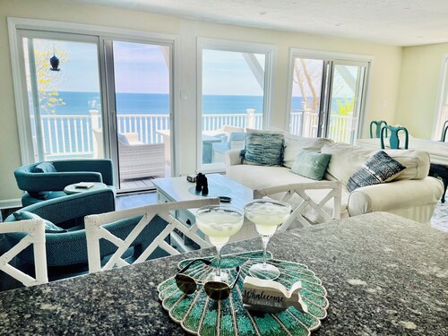 Home with spectacular panoramic ocean views from a bluff high above Cape Cod Bay