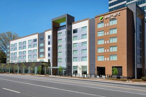 A modern hotel building with multiple floors, large windows, and a prominent 'element' logo.