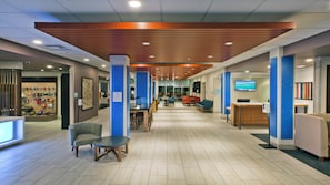 A spacious lobby with a reception desk, seating area, and a display of merchandise. - Holiday Inn Express & Suites Green River by IHG (Green River)