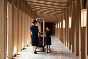 A long corridor with a uniform design, featuring a series of columns and a central walkway.