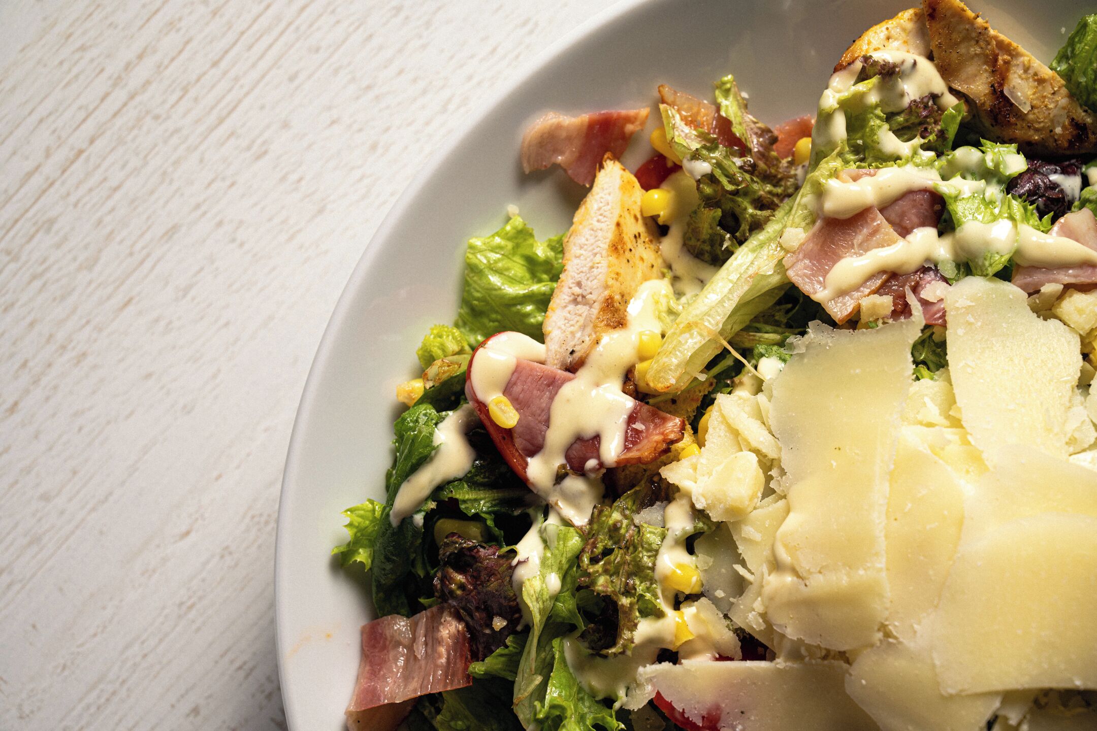 A plate of salad with various ingredients.