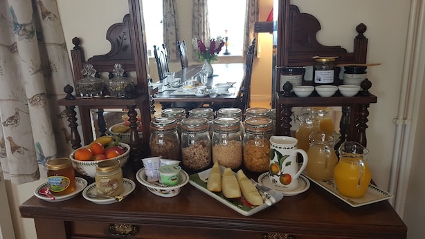 A breakfast buffet with various food items and condiments. - Burton Grange Farmhouse B&B (York)