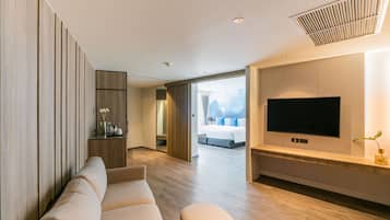 Minibar, desk, laptop workspace, bed sheets