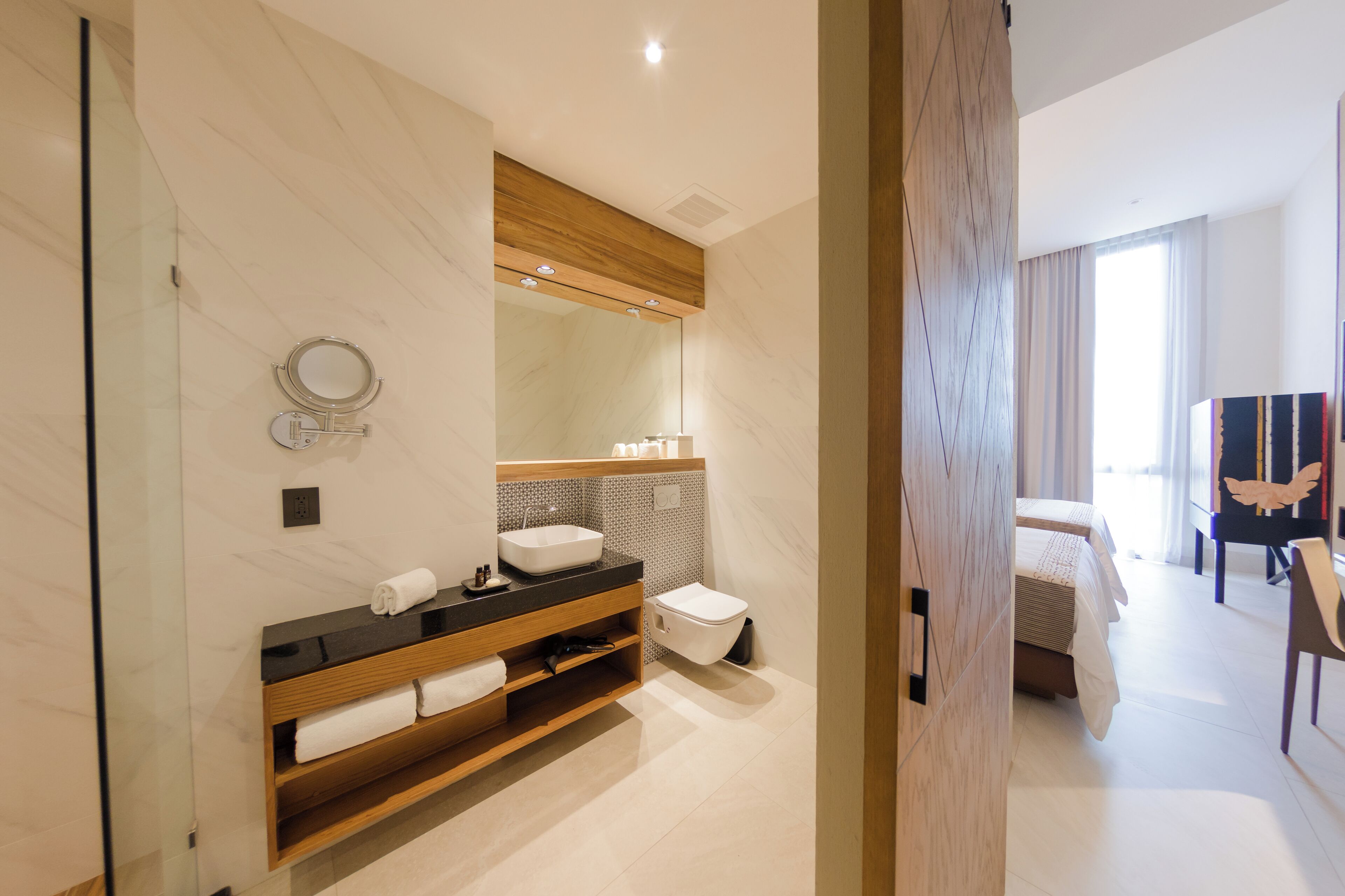 junior suite | bathroom | hair dryer, bathrobes, slippers, towels