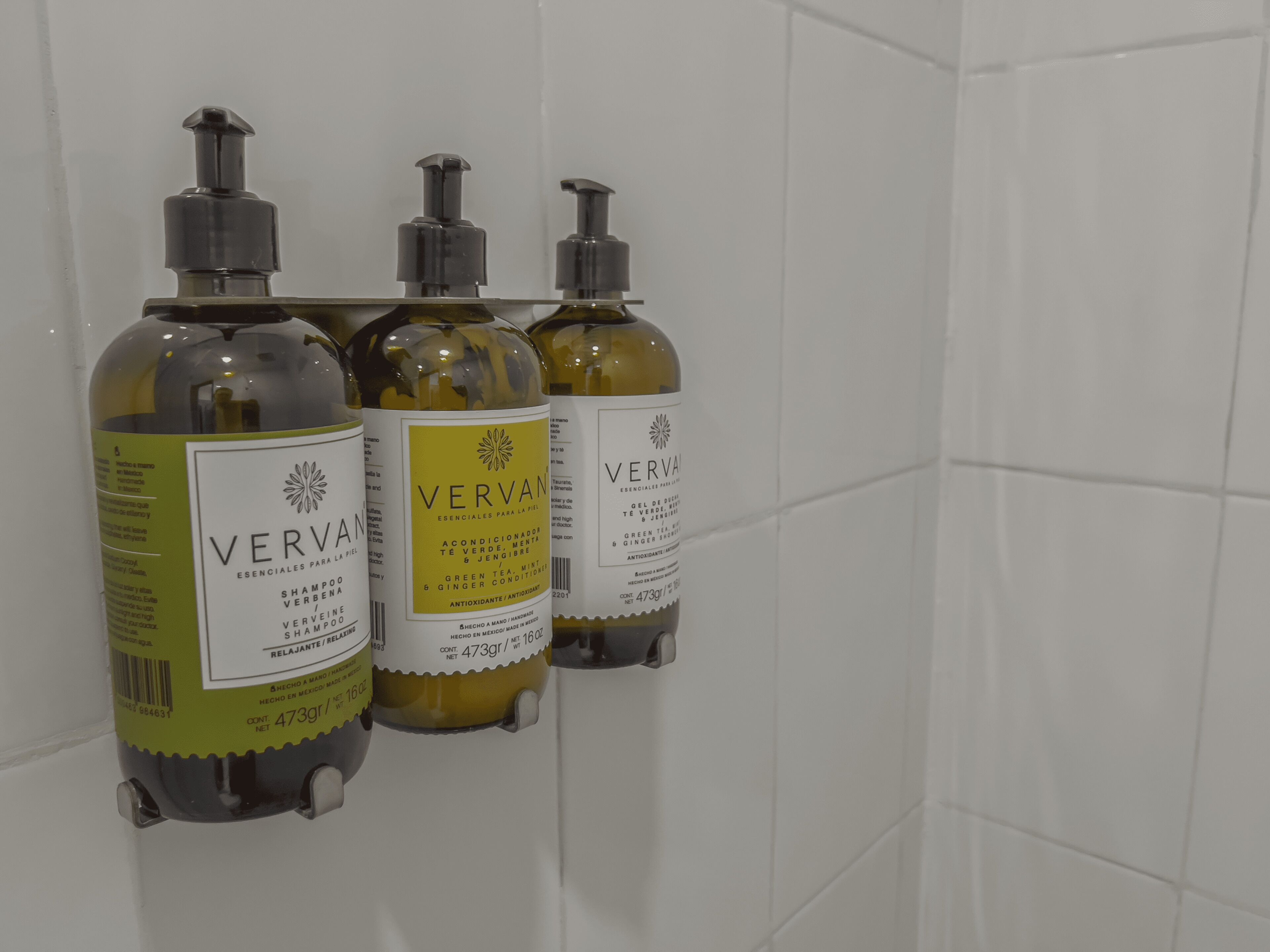 designer toiletries, hair dryer, bathrobes, slippers