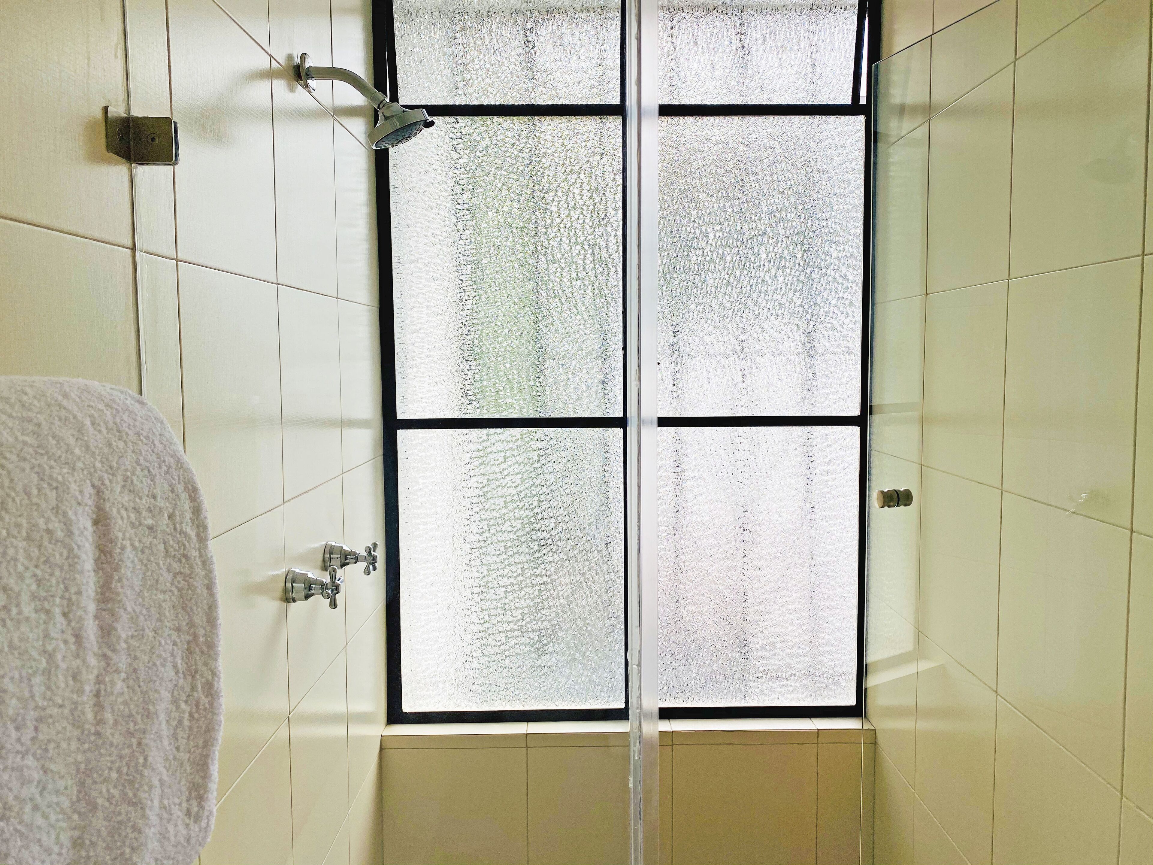 designer toiletries, hair dryer, bathrobes, slippers