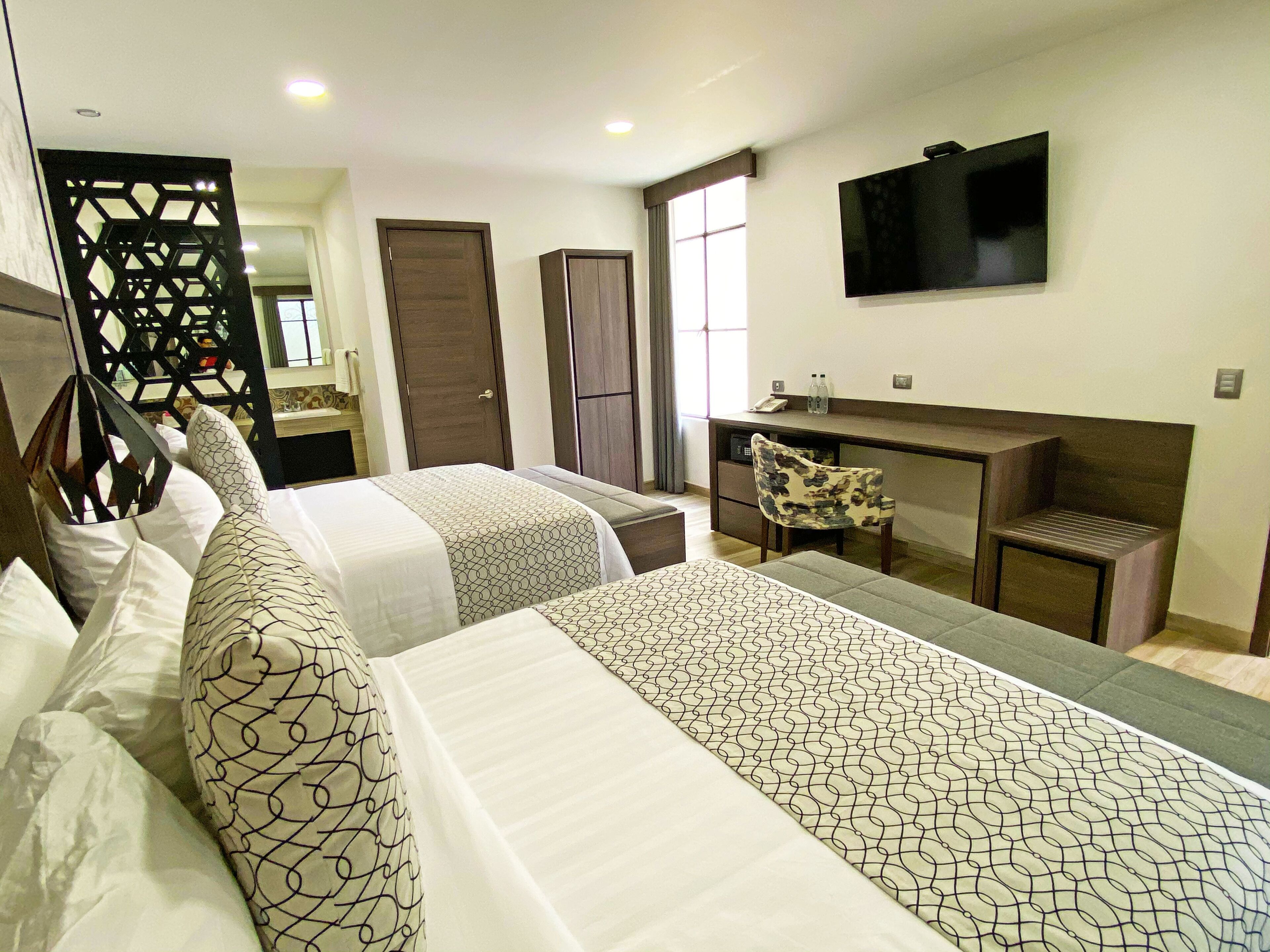 deluxe double room (suite narvarte) | premium bedding, down duvets, in-room safe, laptop workspace