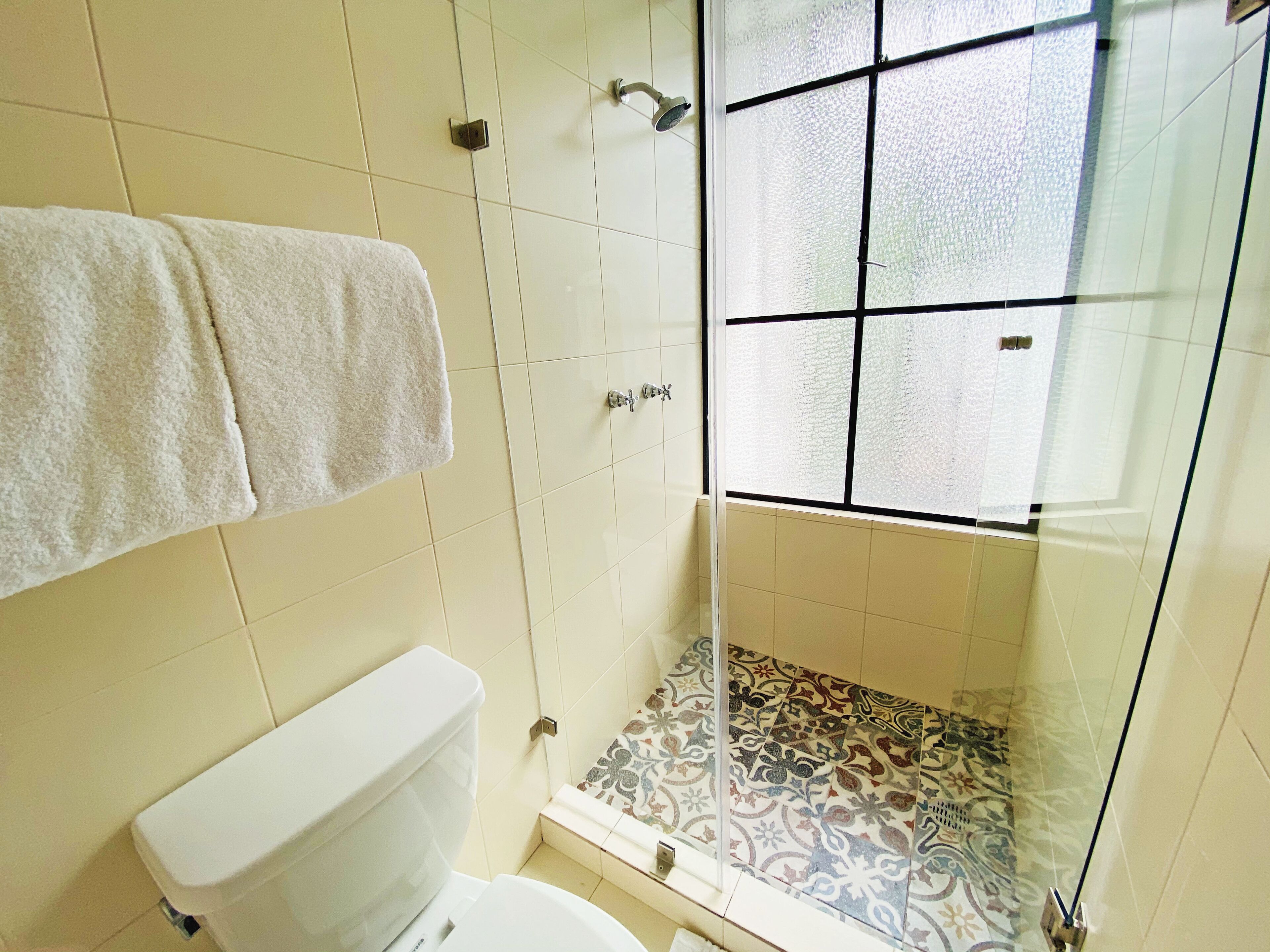 designer toiletries, hair dryer, bathrobes, slippers