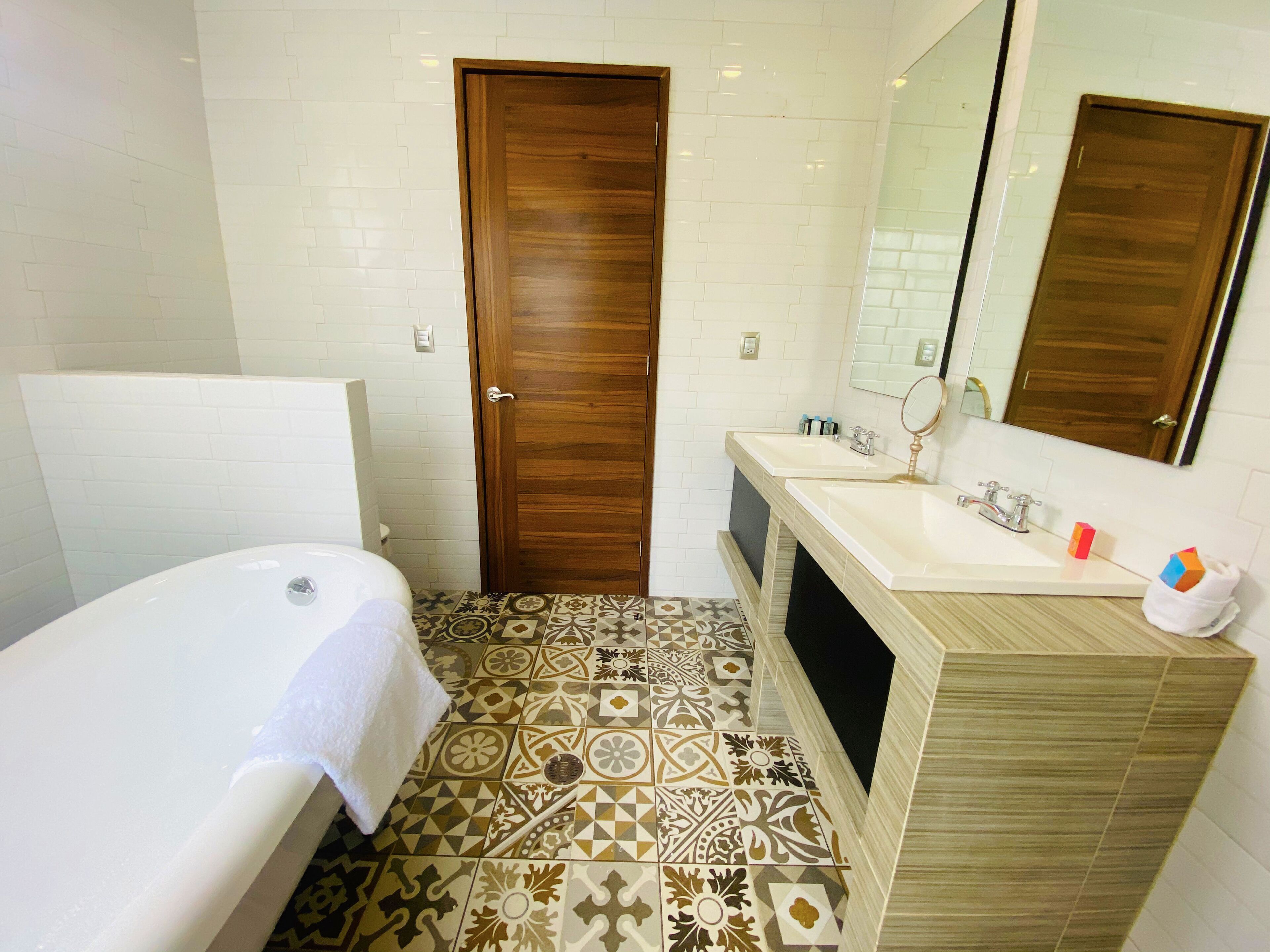 Bathroom | Designer toiletries, hair dryer, bathrobes, slippers