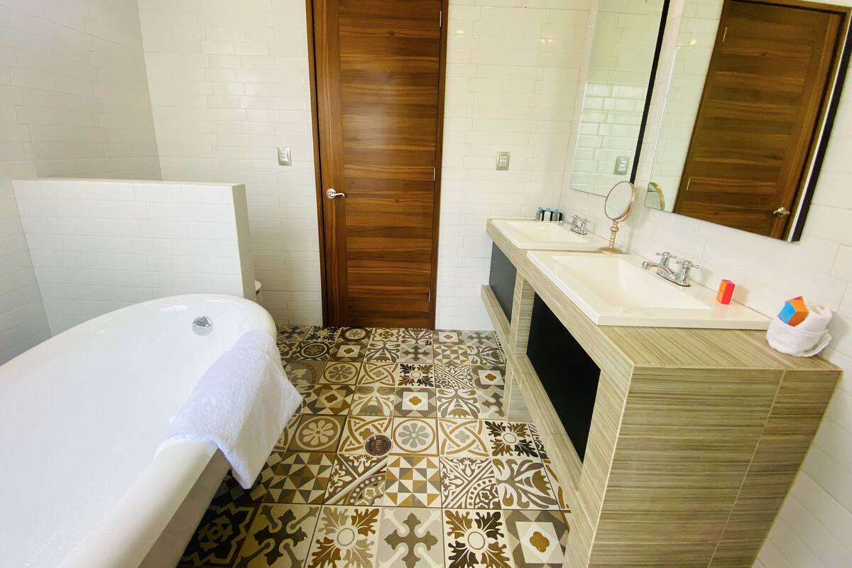 Bathroom | Designer toiletries, hair dryer, bathrobes, slippers