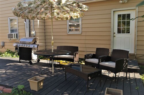 The Bungalow: inviting retreat with a spacious backyard sets for BBQs. 