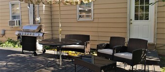 The Bungalow: inviting retreat with a spacious backyard sets for BBQs. 