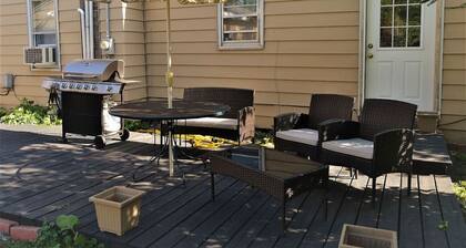 The Bungalow: inviting retreat with a spacious backyard sets for BBQs.