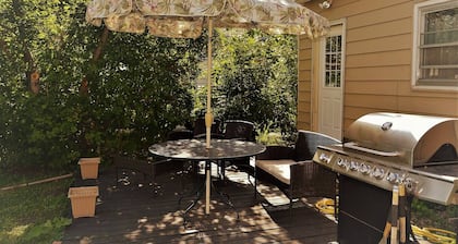 The Bungalow: inviting retreat with a spacious backyard sets for BBQs.