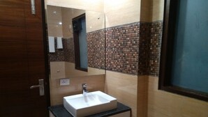 Deluxe Room, Balcony | Bathroom | Shower, free toiletries, towels, soap - Blite Guest House (Gurugram)