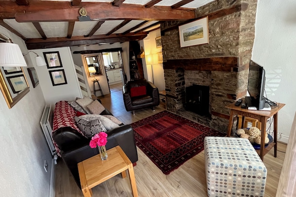 Walk into a cosy original oak beamed sitting room