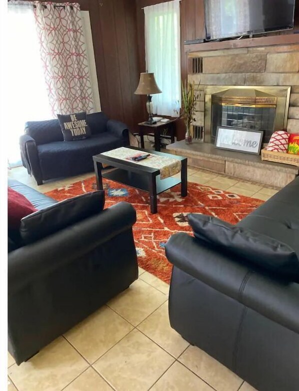 LCD TV, fireplace, table football