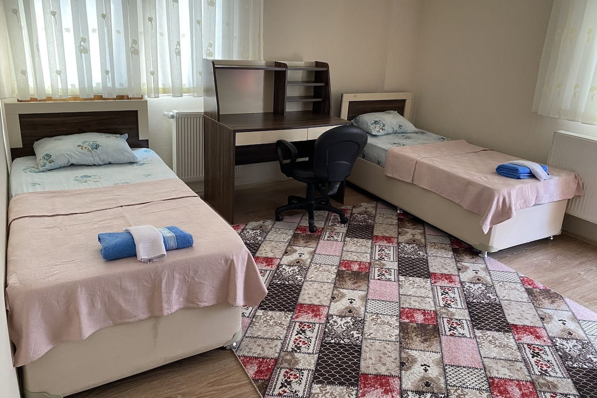 Apartment, 2 Bedrooms | 4 bedrooms, desk, laptop workspace, iron/ironing board