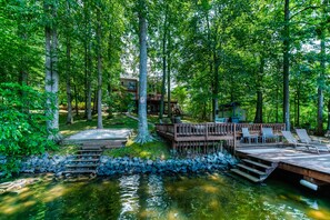 Relax on the lakeside dock with lounge chairs and enjoy the serene surroundings.