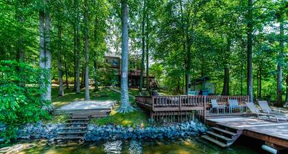 Spacious lake lodge with a private dock, wraparound decks & foosball