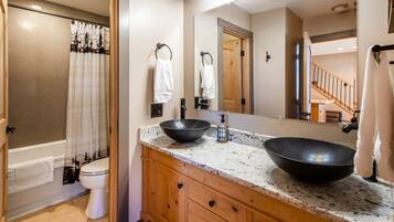 Combined shower/tub, hair dryer, towels, soap