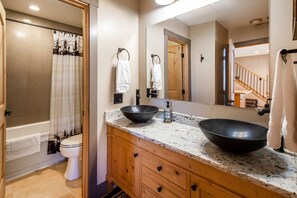Combined shower/tub, hair dryer, towels, soap