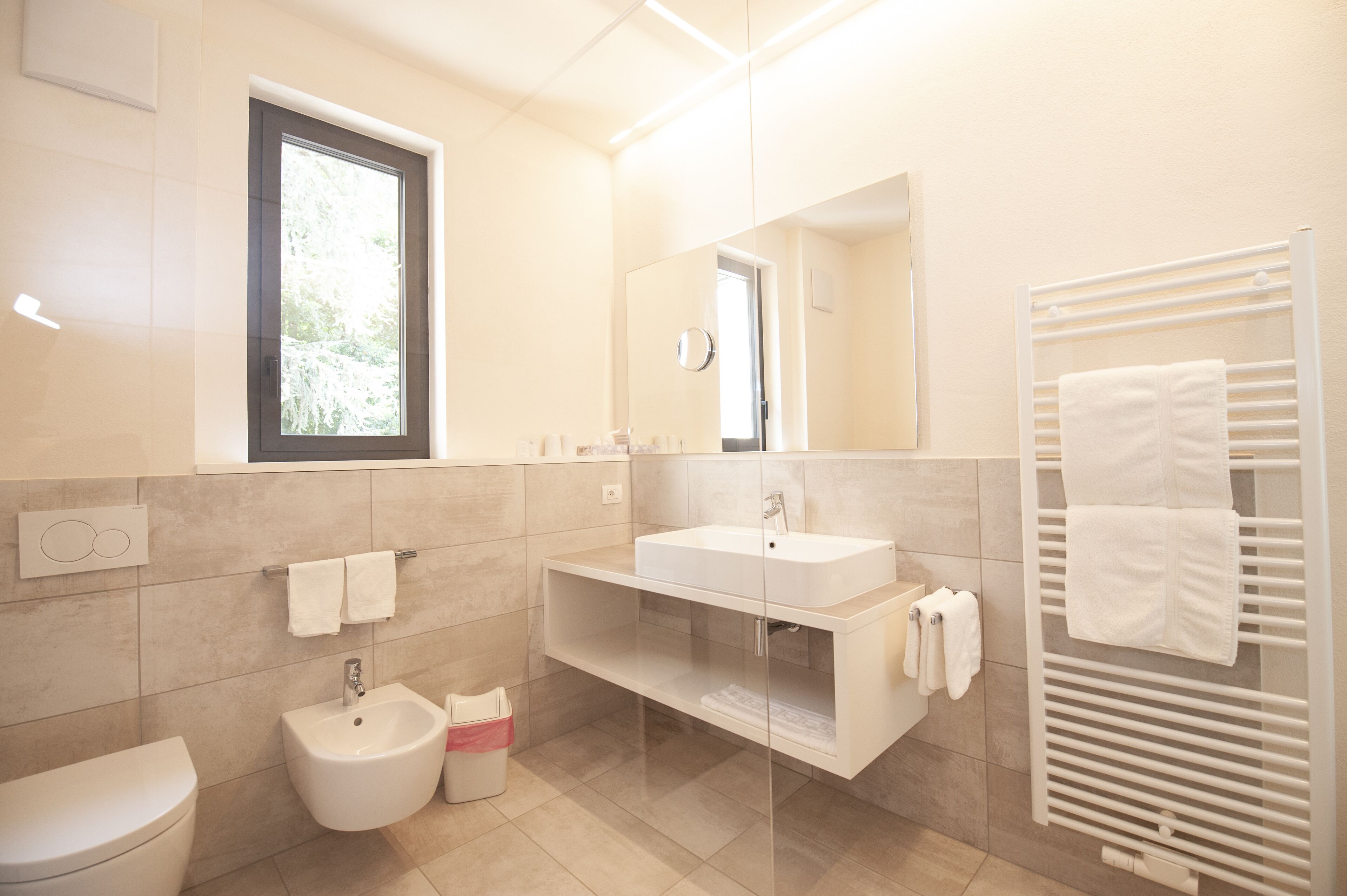 superior double room | bathroom | hair dryer, bidet, towels