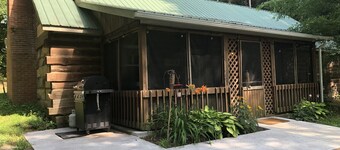 
 Rustic Cabin Retreat on 120 Acres with Private Lake, Wildlife, and Fireplace.