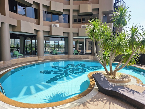 Outdoor pool, open 7:00 AM to 10:00 PM, sun loungers