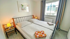 2 bedrooms, travel crib, WiFi, bed sheets