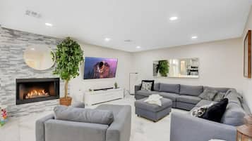 Smart TV, fireplace, video game console, table football