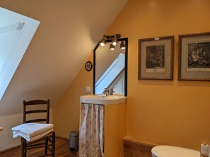 Bathtub, hair dryer, towels, soap