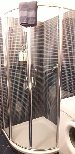 Shower, hair dryer, towels, soap