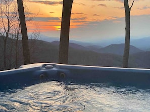A hot tub with a view of a sunset and mountains. - September Special | Hot Tub+Breathtaking Mtn Views (Spruce Pine)