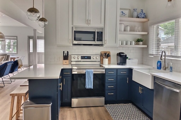 Kitchen stocked with all cups, plates, pots, pans, utensils, etc.