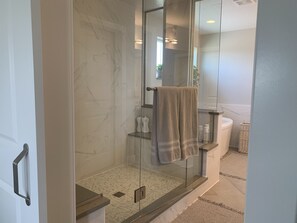 Combined shower/tub, hair dryer, towels, soap