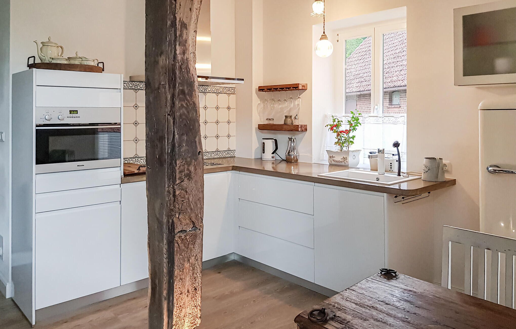 Fridge, stovetop, dishwasher, coffee/tea maker