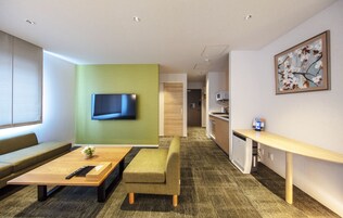 Deluxe F Non-Smoking | Living area | Flat-screen TV