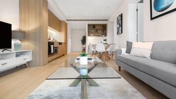 One Bedroom Apartment | Living room | 49-inch Smart TV with digital channels, TV