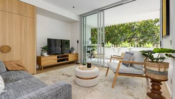 Two Bedroom Apartment | Living area | 49-inch Smart TV with digital channels, TV