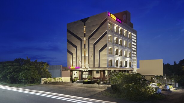 A modern hotel with a prominent 'Click Hotels' sign, multiple floors, and a well-lit entrance area. - Click Hotel Aurangabad (Chhatrapati Sambhajinagar)