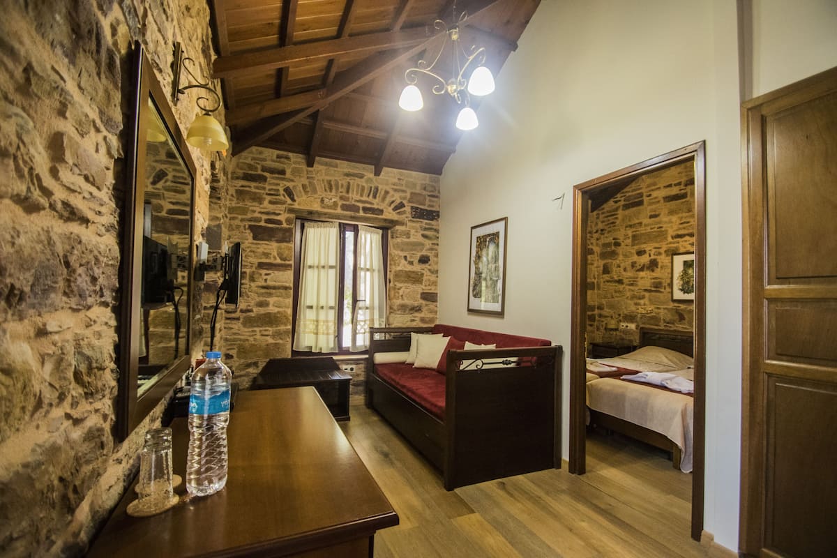 Junior Suite | Living area | 24-inch LCD TV with cable channels, TV, DVD player