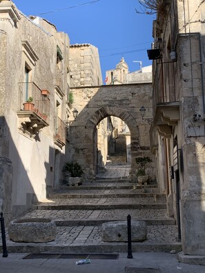 Stroll through historic streets lined with traditional stone buildings and charming balconies.